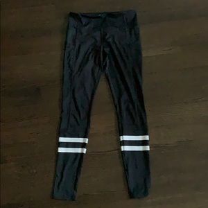 Black leggings with white stripes